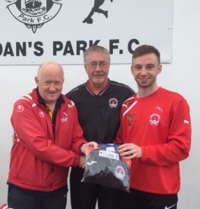 Jesse Stafford Lacey with his former St Brendans Coach Danny Diggins and St Brendans Park Fc Chairman Colm McLoughlin